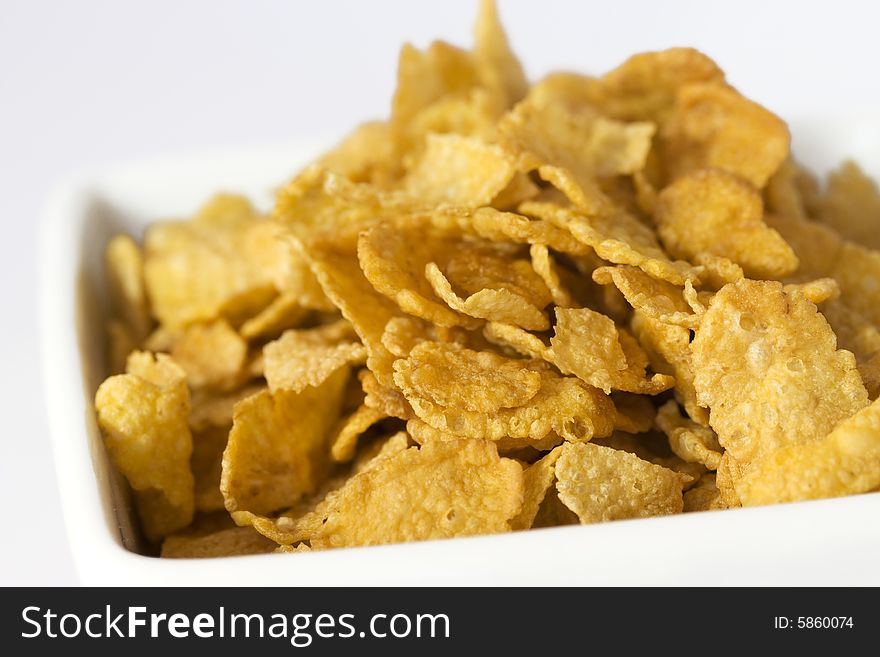 Close up photo of a cup of corn flakes for a morning breakfast