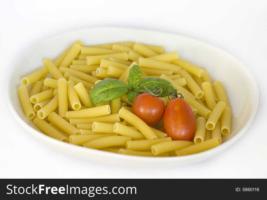 Photo of a fresh italian food ingredients with pasta tomato and basil