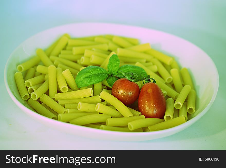 Photo of a fresh italian food ingredients with pasta tomato and basil