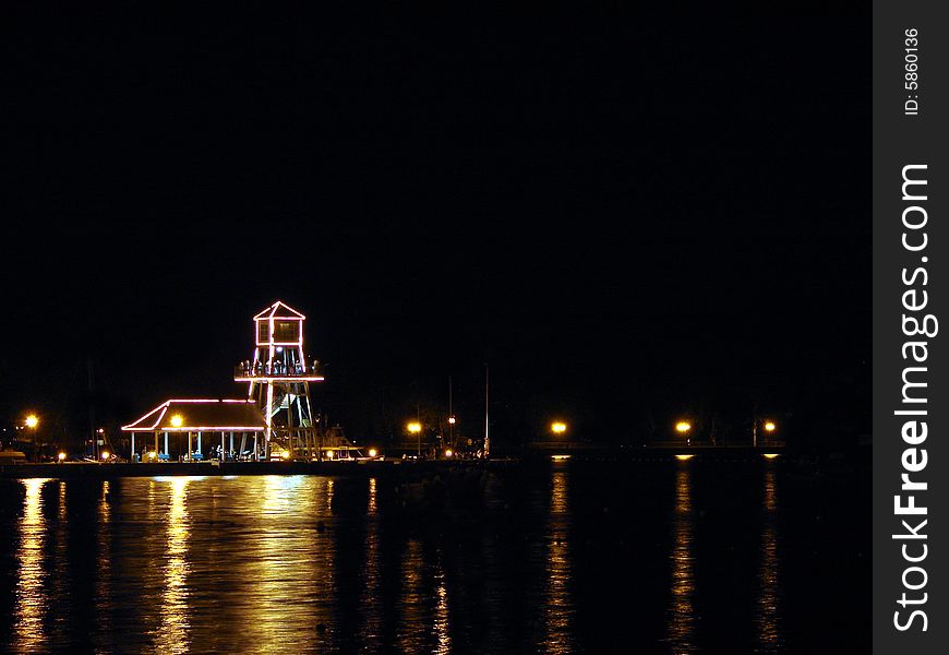 Observatory tower at night on Memphremagog Lake in Magog, Province of Quebec, Canada. Observatory tower at night on Memphremagog Lake in Magog, Province of Quebec, Canada