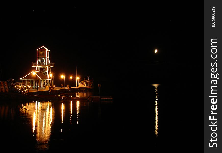 Observatory tower at night on Memphremagog Lake in Magog, Province of Quebec, Canada. Observatory tower at night on Memphremagog Lake in Magog, Province of Quebec, Canada