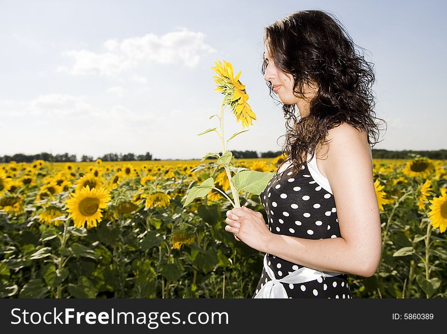 Girl in field with sunflower
