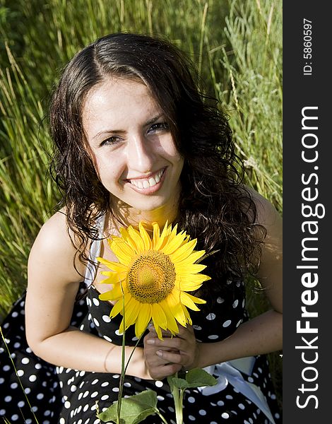 Portrait of smiling girl with sunflower