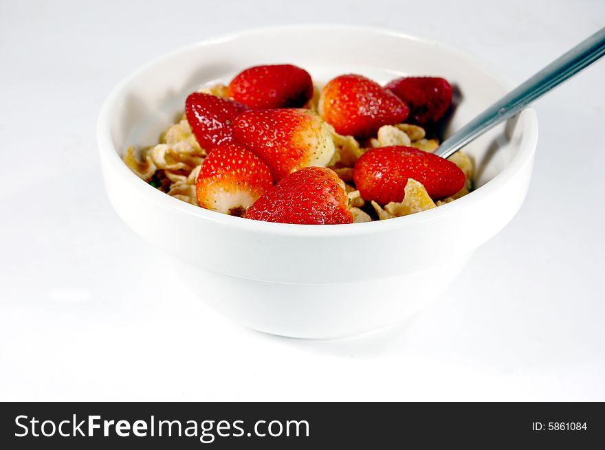 Cereal bowl with strawberries isolated on a white background. Cereal bowl with strawberries isolated on a white background