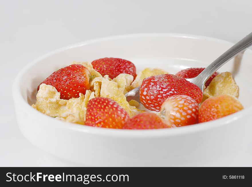 Macro shot of a cereal bowl with strawberries. Macro shot of a cereal bowl with strawberries