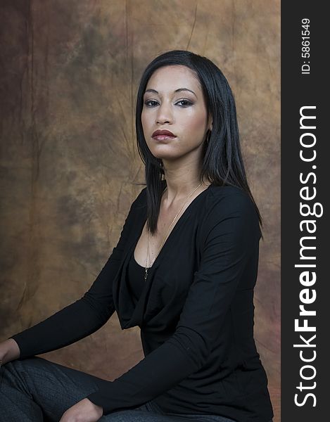 A head and shoulders of a young lady sitting side on looking at camera. A head and shoulders of a young lady sitting side on looking at camera.