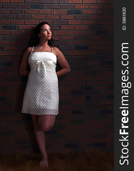 Natural light portrait of a pretty woman in white dress