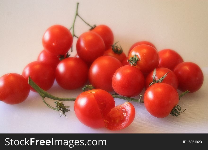 A bunch of ripe cherry tomates. A bunch of ripe cherry tomates