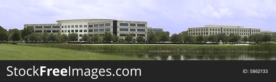 Two office buildings with pond panoramic.