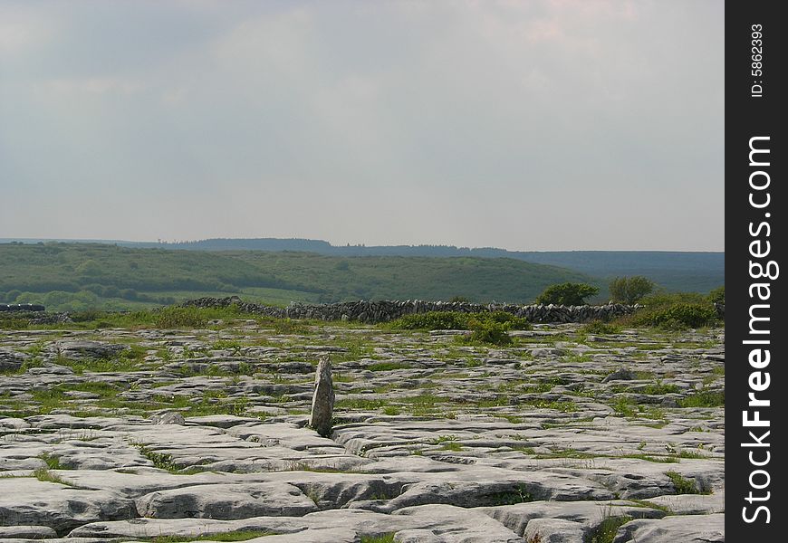 A scenic view of a rocky flat landscape. A scenic view of a rocky flat landscape.