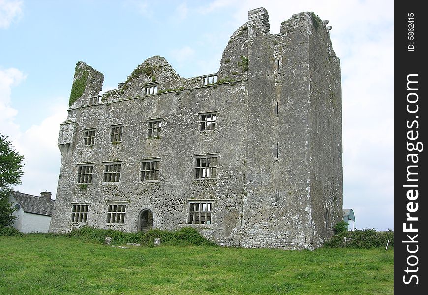 The remains of an ancient Irish castle still stand on the west coast of Ireland. The remains of an ancient Irish castle still stand on the west coast of Ireland.