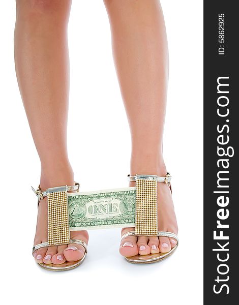 Woman legs with money on white