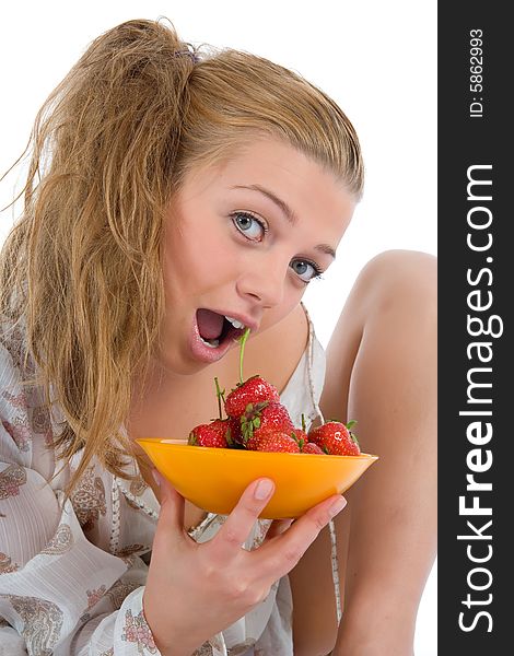 Beautiful girl with strawberry over white