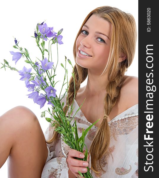 Beautiful woman with flowers on white