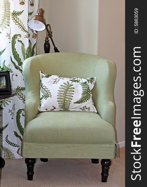 Comfy green chair and pillow