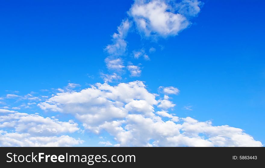 White cloud in the form of the head of giraffe against the bright blue background of summer sky. White cloud in the form of the head of giraffe against the bright blue background of summer sky.