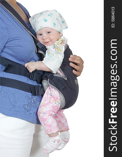 The child in a backpack on a breast of mother