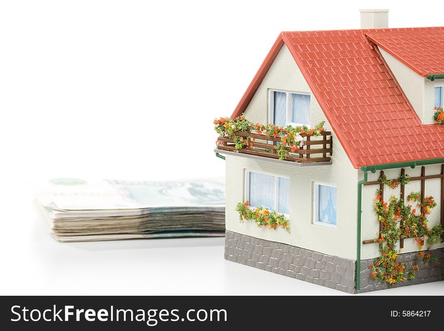 Miniature House and Money. Buying house concept