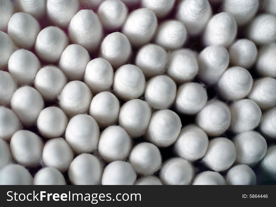 A close up photograph of a pack of sterile cotton swabs. A close up photograph of a pack of sterile cotton swabs