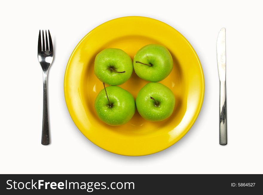 Green apples  in yellow plate on white background. Green apples  in yellow plate on white background