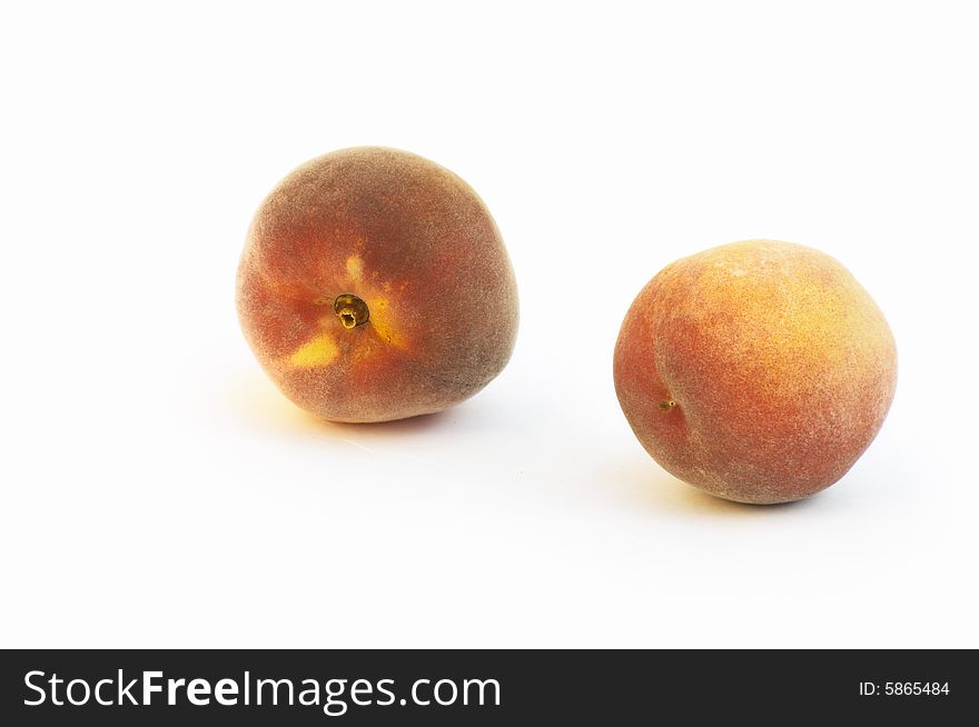Two peaches on white background