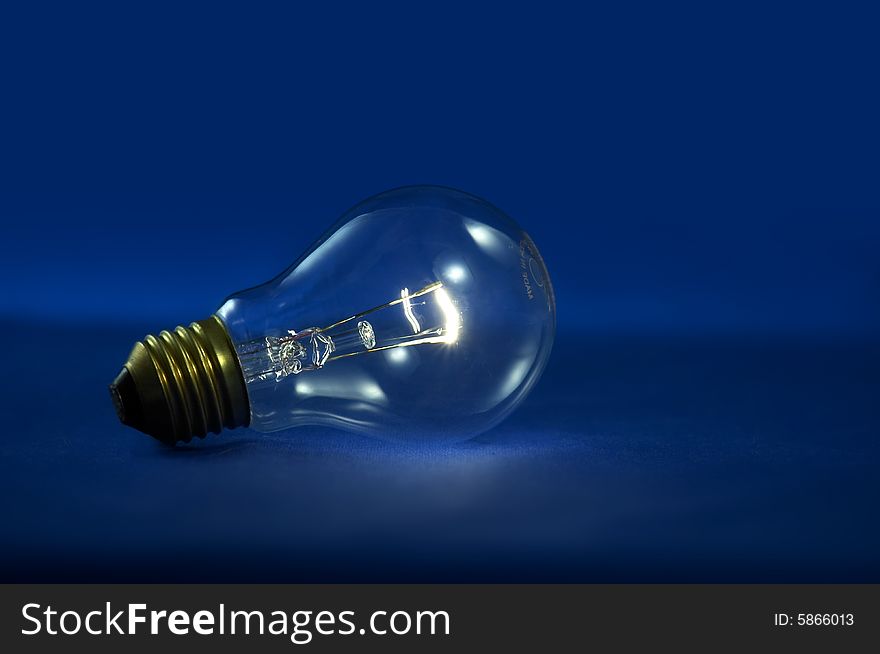 A bulb light on blue background. A bulb light on blue background