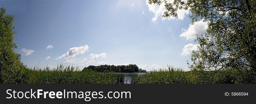 Panorama review with pure water, the sky in clouds