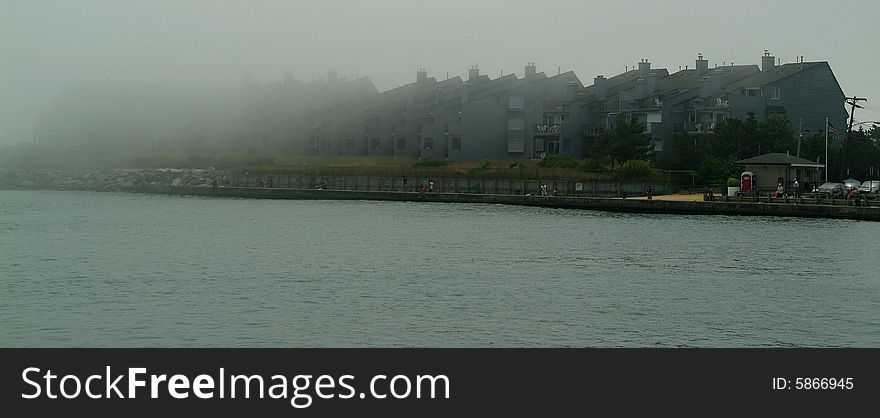 Condos in fog on the inlet