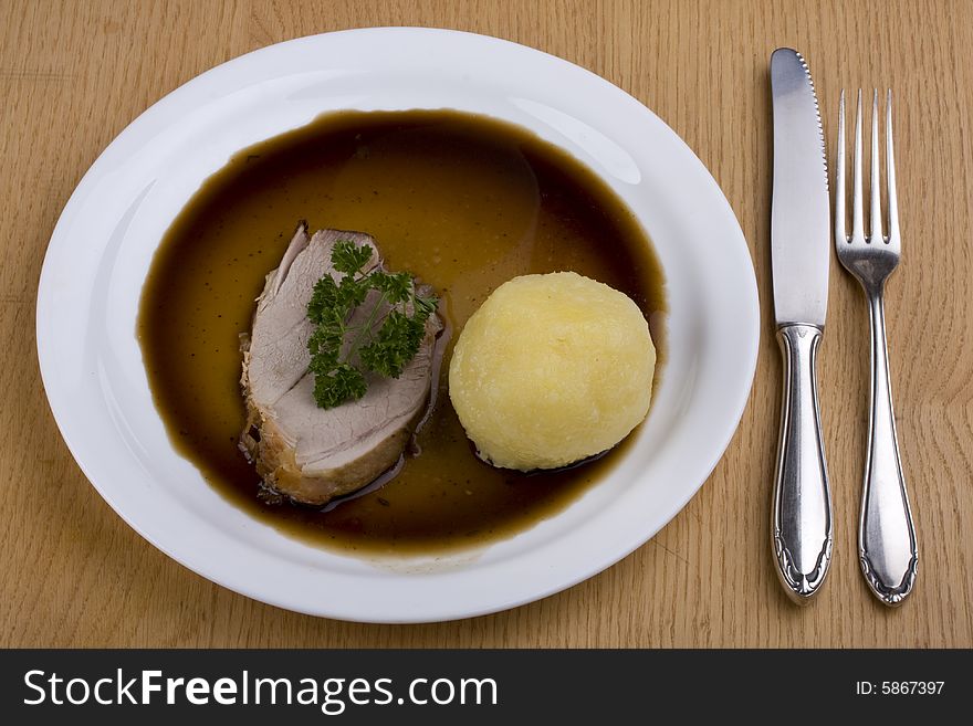 Bavarian roast pork dish with potato dumpling