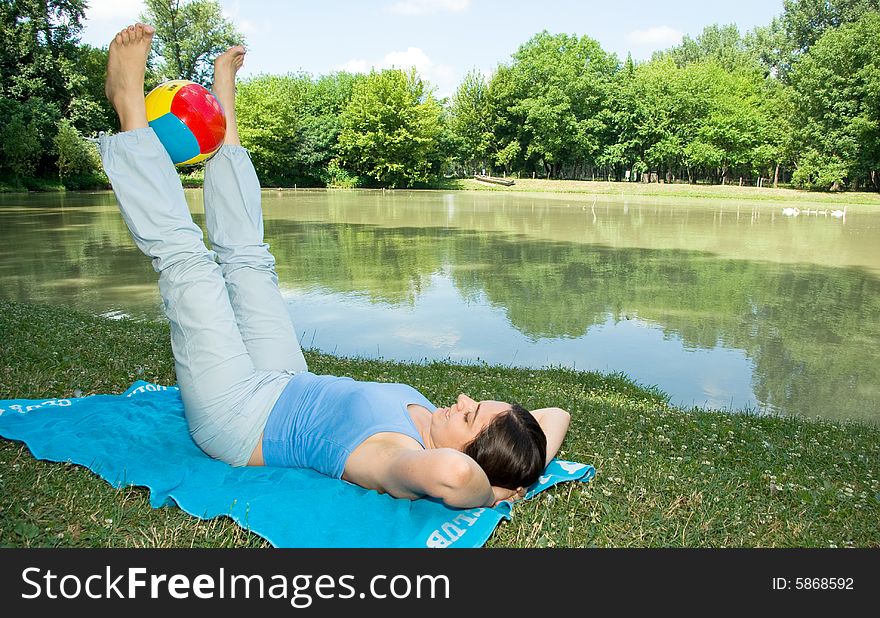 Girl Enjoying Some Exercises With Ball Outdoors