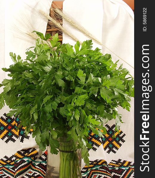 Parsley a bunch in a composition with the Ukrainian national towels