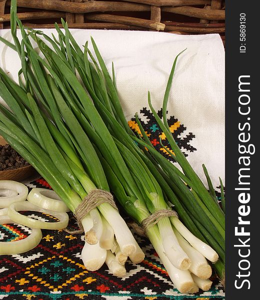 Bunches of a green onions on the Ukrainian national towels