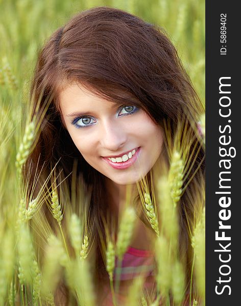Portrait of the beautiful girl in wheat field. Portrait of the beautiful girl in wheat field