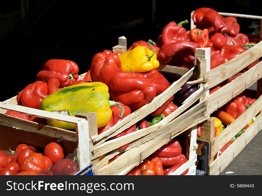 Red and yellow peppers in a sunny day in Rome.