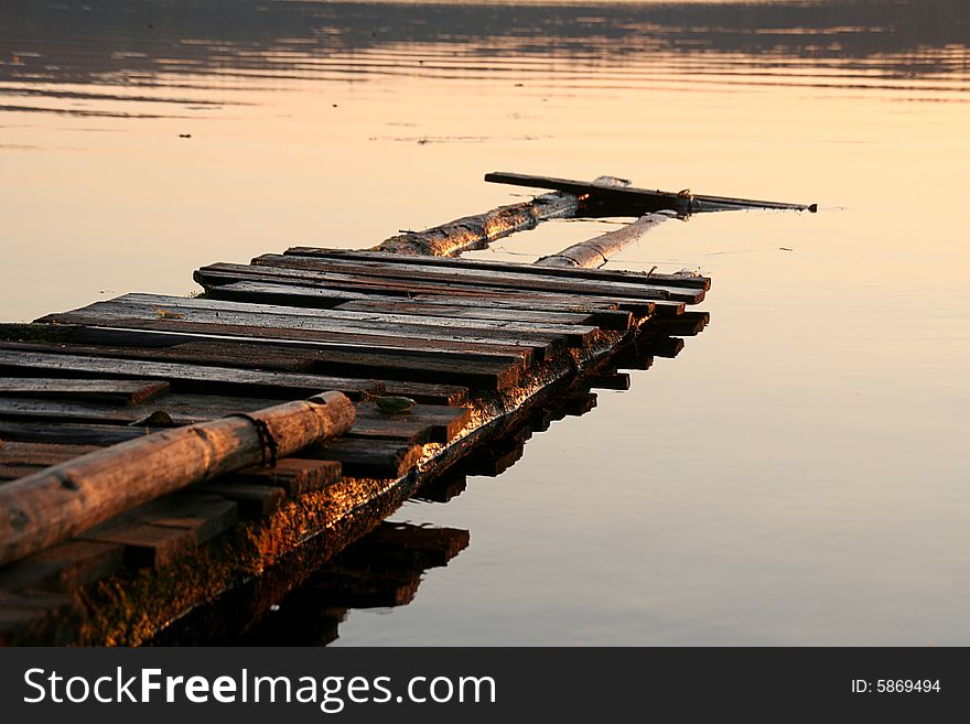 View ruinous a foot-bridge on a sunset. View ruinous a foot-bridge on a sunset