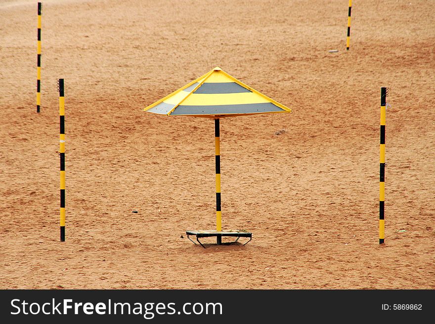 An empty sandy beach with columns. An empty sandy beach with columns