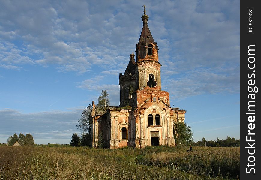 Abandoned church on background blue sky