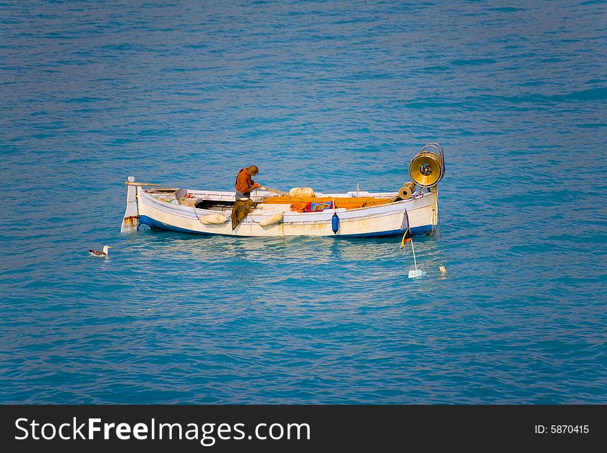 Fisherman in the water near the city nice in france