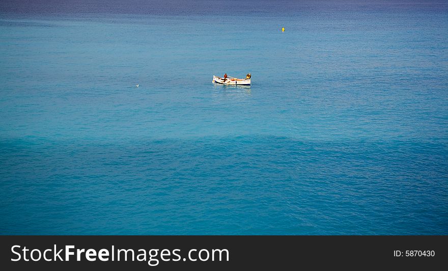 Fisherman in the water near the city nice in france