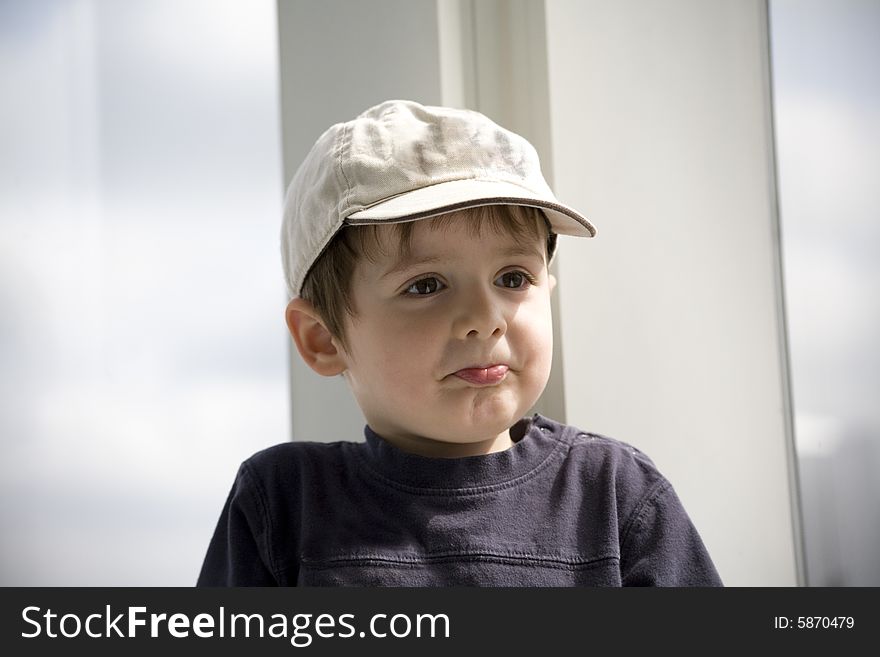 Kid with hat doing a funny face