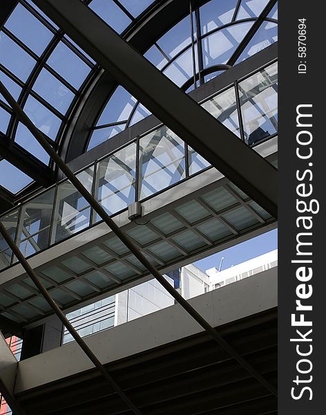 Glass and metal suspended structure over building entrance. Glass and metal suspended structure over building entrance.