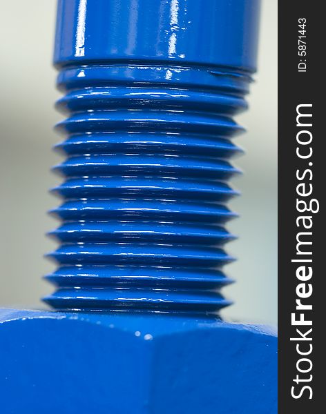 Close-up photo of shiny, blue nut and bolt