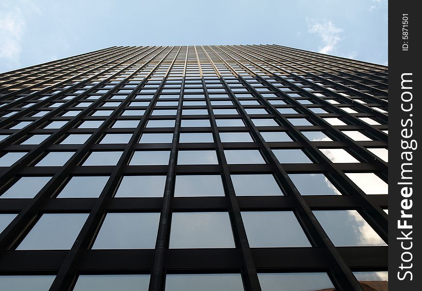 Looking up at the windows of a skyscraper. Looking up at the windows of a skyscraper.