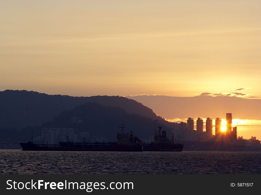 Sunset at harbour near city