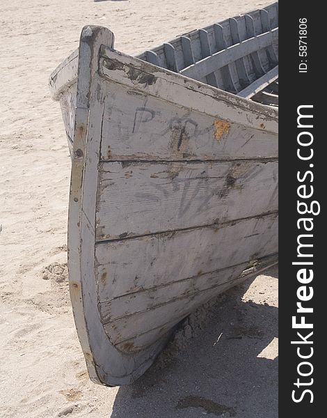 Old fishing vessel beached on sand. Old fishing vessel beached on sand