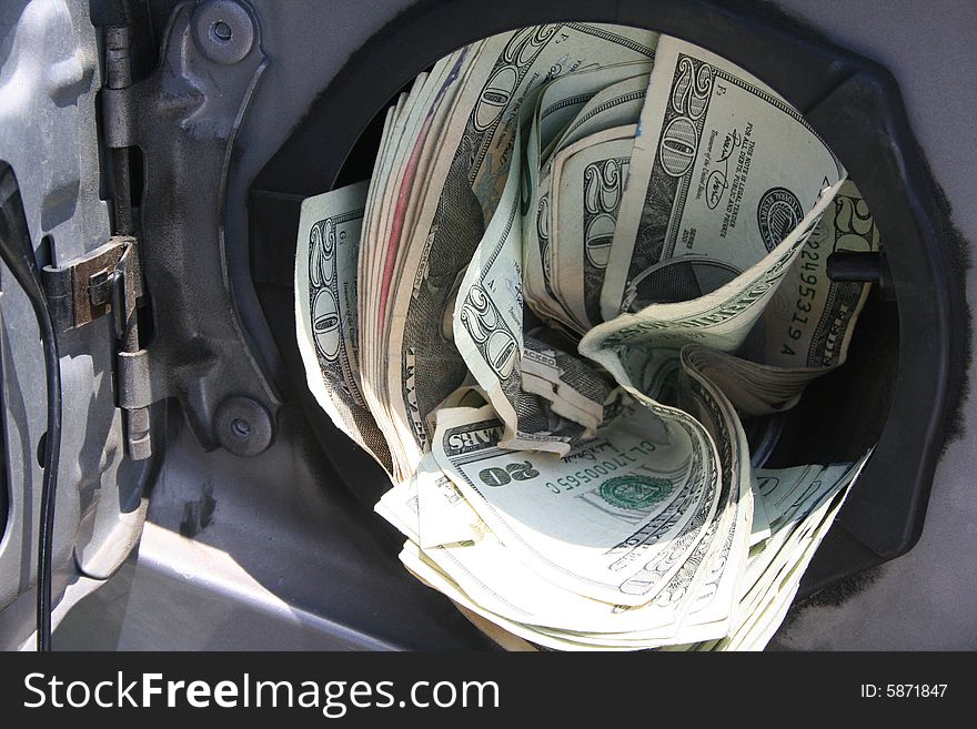 Hundreds of dollars stuffed into a gas tank. Hundreds of dollars stuffed into a gas tank.