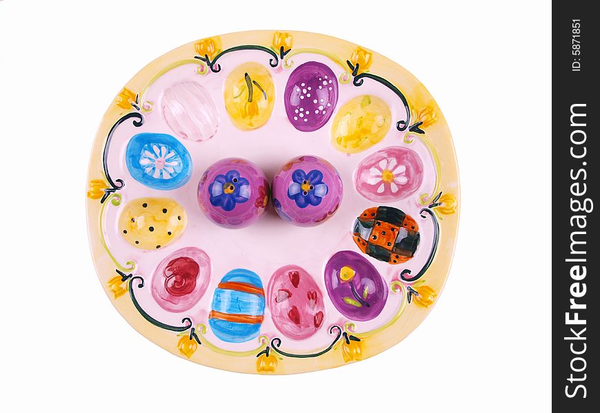 Colorful decorative plate top view with egg shaped salt & pepper shakers. Colorful decorative plate top view with egg shaped salt & pepper shakers