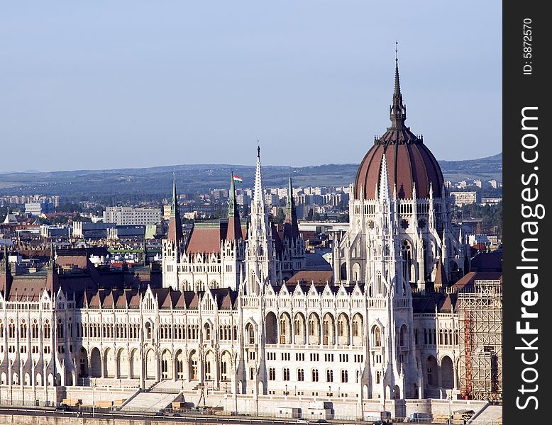 Hungarian house of parliament under reconstruction on the bank of danube.