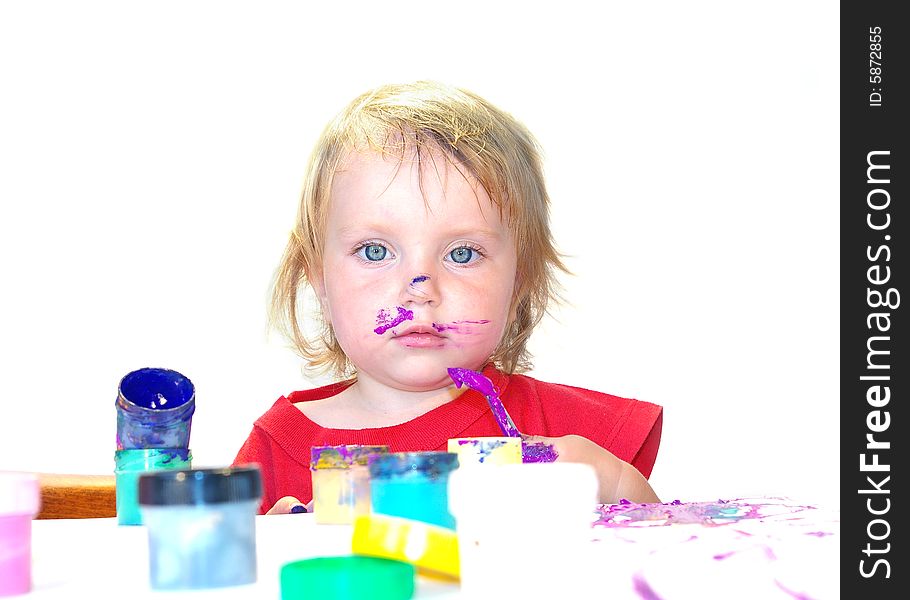 Little girl draws on a table isolated. Little girl draws on a table isolated