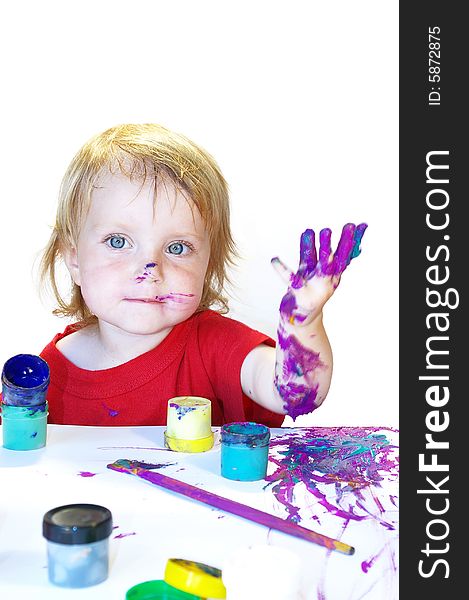 Little girl draws on a table isolated. Little girl draws on a table isolated